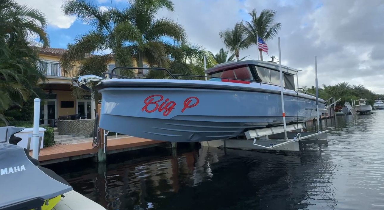 Permitted boat lift installation in Boca Raton residential canal